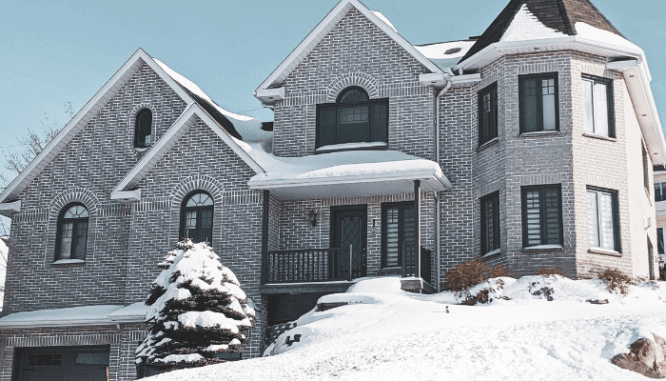 An image of a home in snow to demonstrate various types of real estate investments.