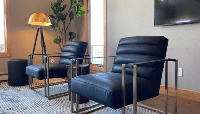 Two chairs in a home that uses a mountain contemporary design.