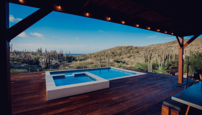 A custom pool design featuring a wooden deck.