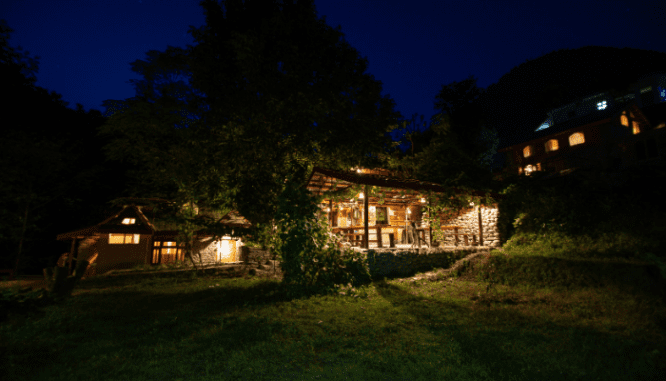 An image of a house at night to demonstrate the process of selling in a seller's market.