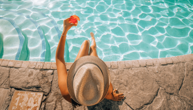 A person celebrating because they just bought a house in Palm Springs.