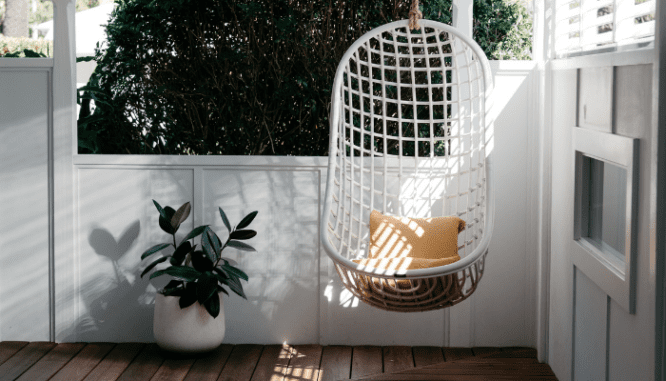 An image of a deck with chair to demonstrate how to clean a deck before staining.