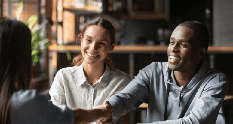 An image of a couple buying a home to demonstrate how to get a mortgage loan.