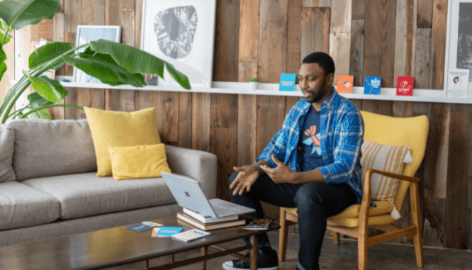 A homebuyer using a computer to discuss a house fire with their agent.