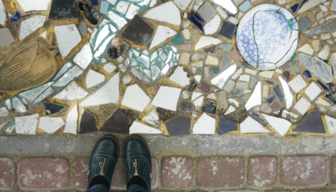 An image of shoes and terrazzo flooring to demonstrate what terrazzo is.