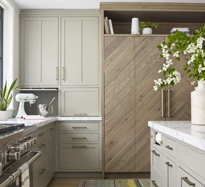 A kitchen with accented cabinets that are on trend.
