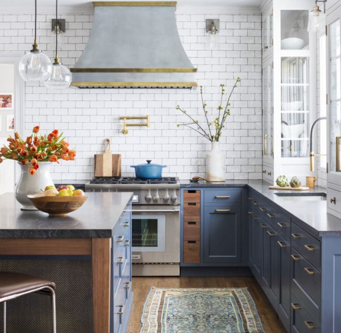 A kitchen with blue cabinets that are on trend.