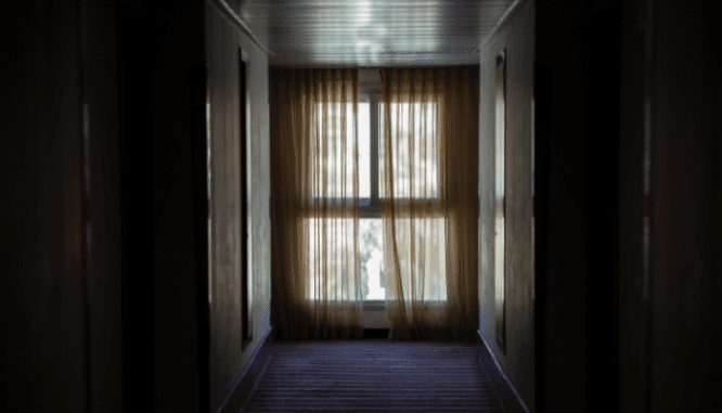 A hallway in a house that was destroyed before closing.