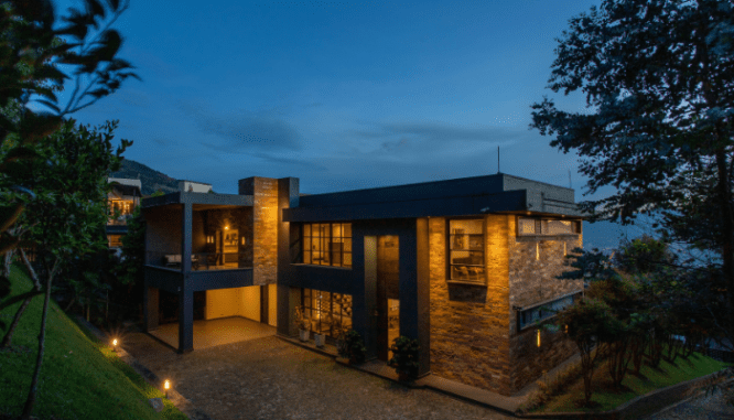 An image of a house at night to demonstrate how to FSBO.