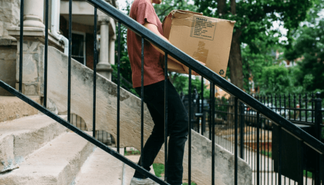 A person moving their stuff into storage when the seller didn't complete repairs on their new home.
