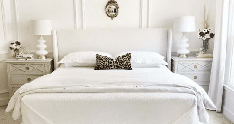 A bedroom where a bedskirt may be out of style.