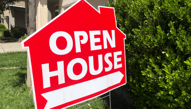 A sign indicating an open house, where you'll want to consider all the open house do's and don'ts