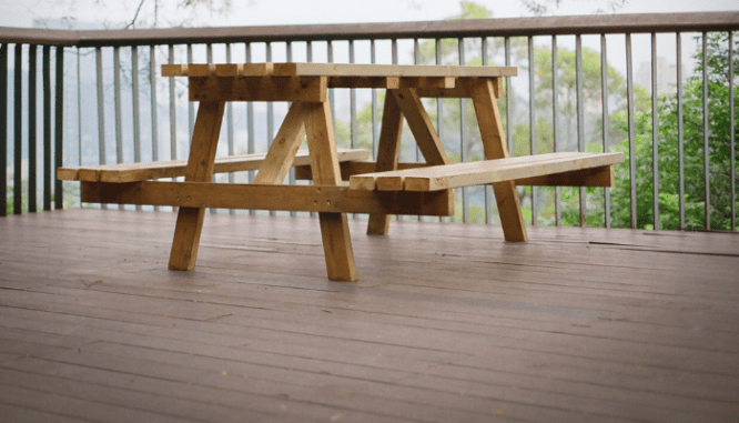 a picnic table on a deck, which you might want to know how to power wash.