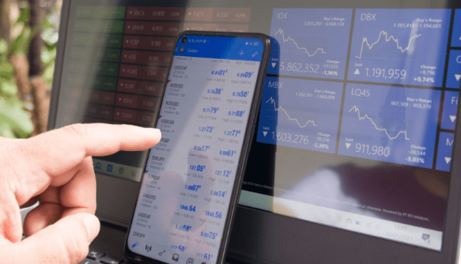 A person looking at the stock market, so they can decide to sell their house or invest.