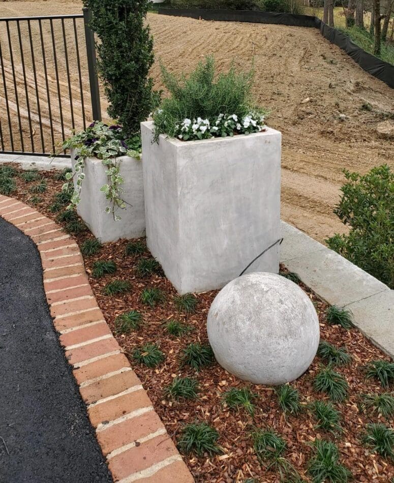 A brick pathway used to accentuate landscaping.