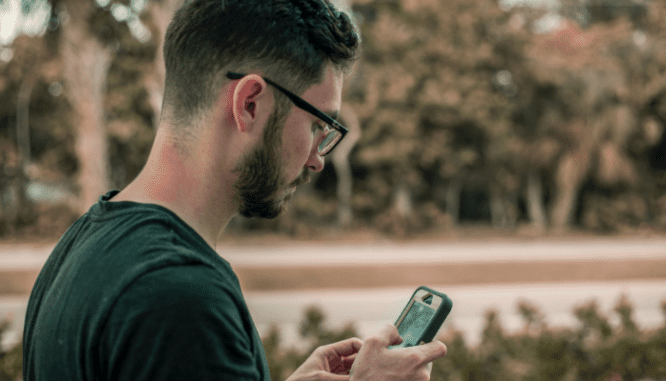 A person using a phone to deal with a low appraisal on a house.
