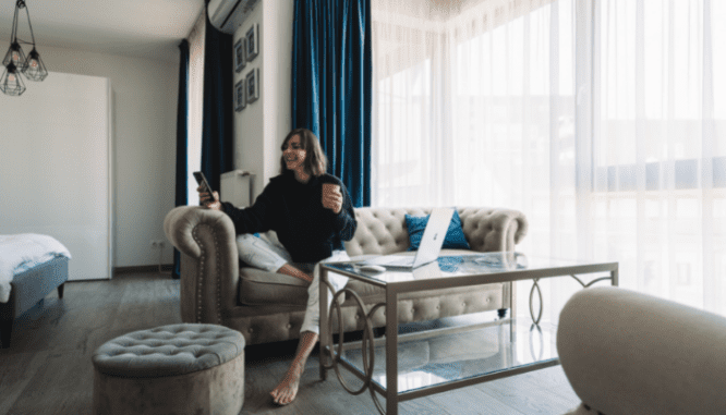 A seller talking to an agent on the phone about accepting an offer on a house.