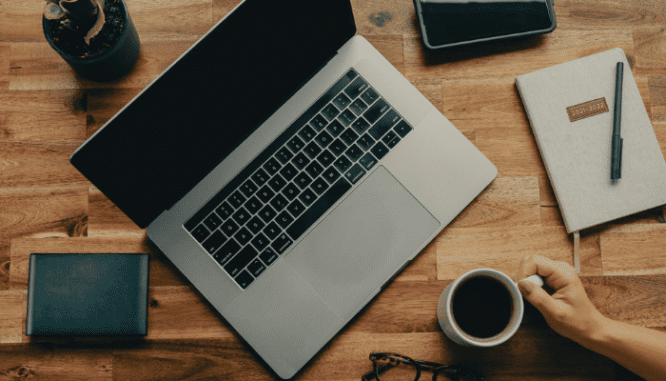 A homeseller using a laptop to decide if her Realtor is doing a good job.