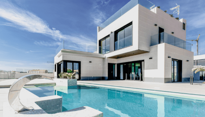 A house displaying modernist architecture with windows that bring in the natural light.