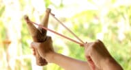 Person using slingshot.