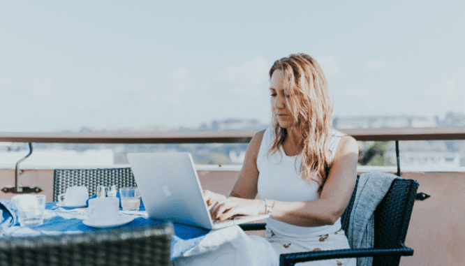 A woman researching what she needs to buy a house.