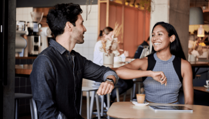 Two people happy about qualifying as first time homebuyers.
