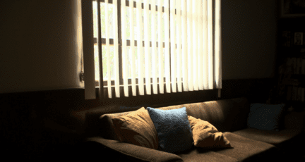 Vertical blinds in a house, which may be out of style.