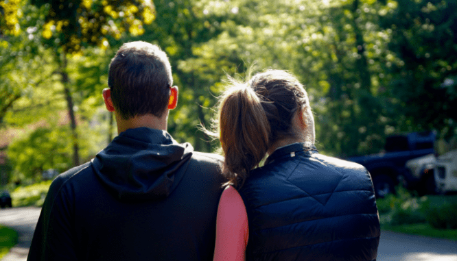 A man and a woman visiting a home.