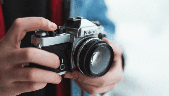 A person taking photos of their necklaces before moving.
