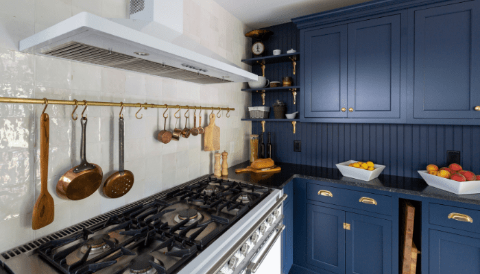A kitchen that has wainscoting.