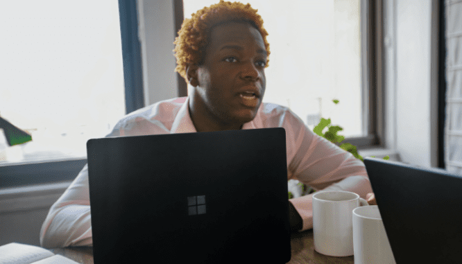 A real estate agent explaining a contract for selling a house.