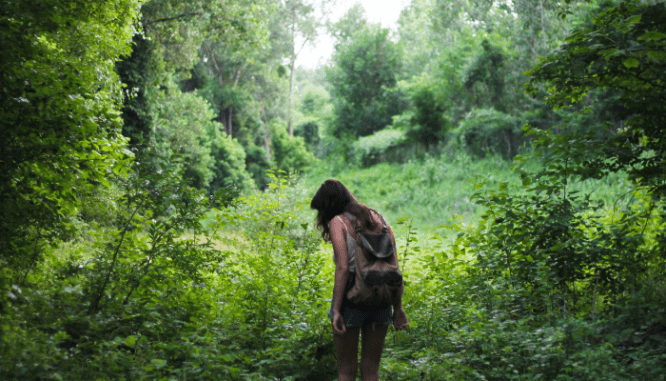 A person hiking in the exurbs.