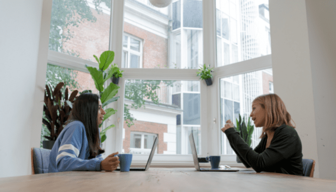Two people discussing how to buy a preforclosure.