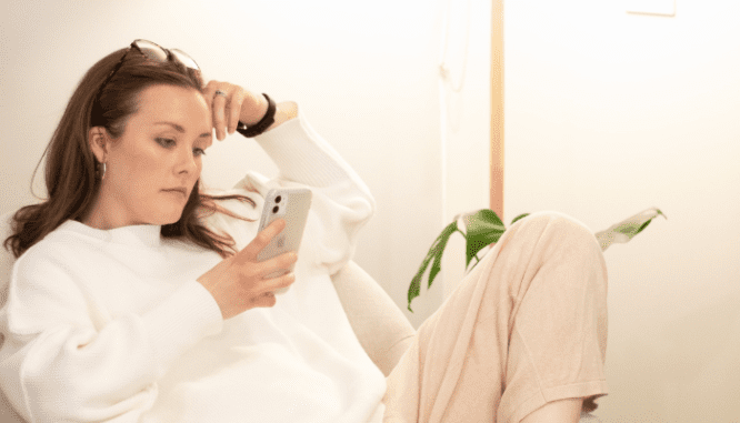 A person researching online how to save for a house with a low income.