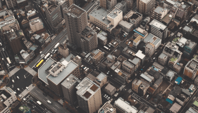 A city with an apartment that you can rent out.