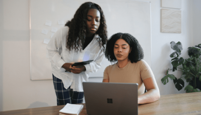 Two people reviewing their inspection contingency clause.