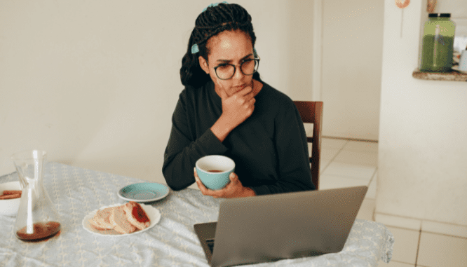A woman looking up states with no property taxes on her laptop.