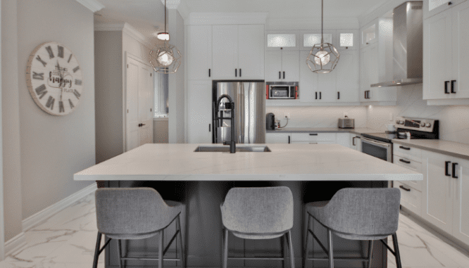 A kitchen with updated countertops and appliances, which you might need to install when remodeling before selling.