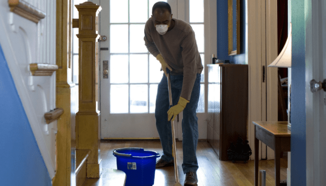 A person cleaning a house, which can be done after probate.