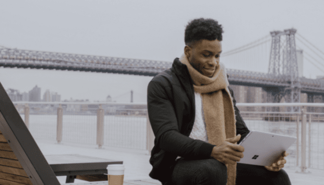 A person researching online about how to save for a house down payment.