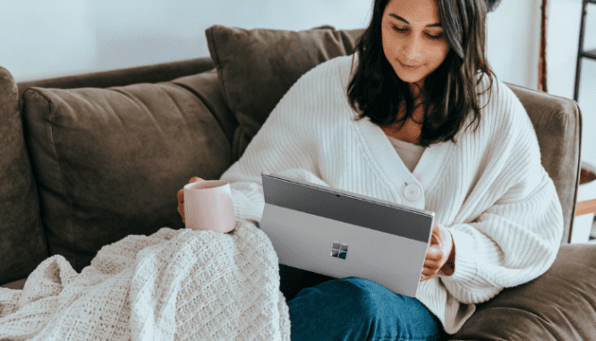 A woman using her tablet to look up the legal documents needed for buying a house.