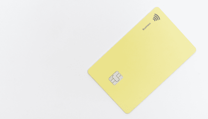 a yellow debit card used by a celebrity to pay for their real estate property