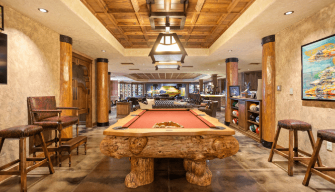 A pool table in a celebrity luxury home for sale.