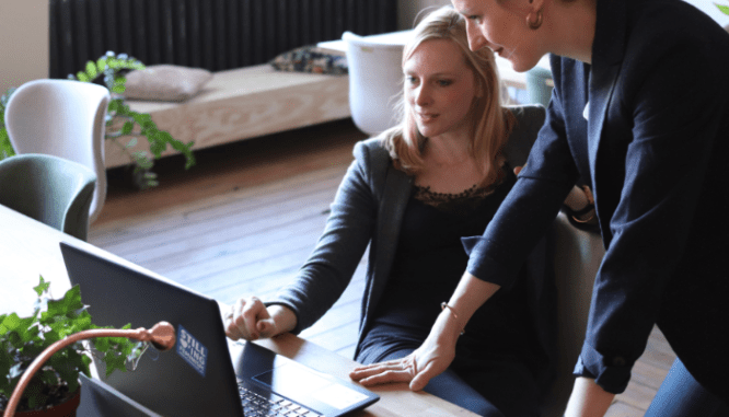 Two people researching down payment assistance in Massachusetts.