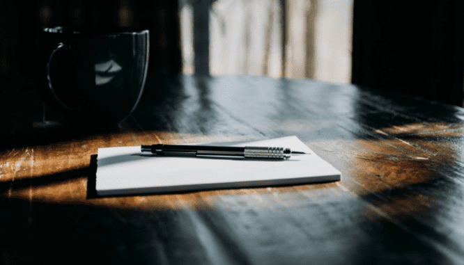 A pen and paper to write a letter to help get a home in 2022.