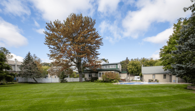 A yard of a house sold by a real estate company.