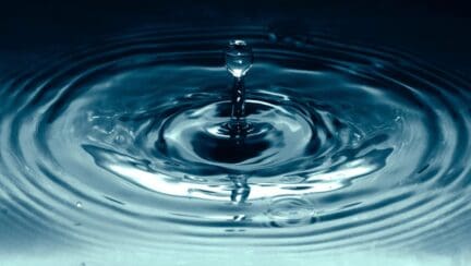 A drop of water illustrates the topic of selling a house with water in the crawl space.