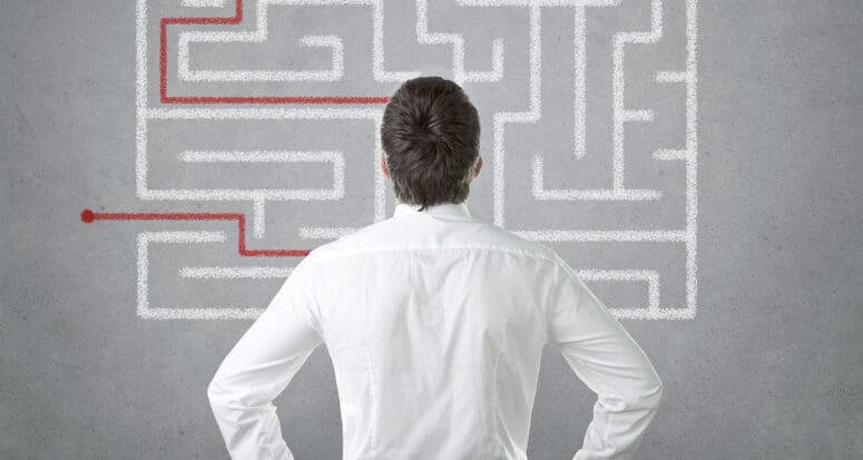 Real estate agent thinking about sales strategies.