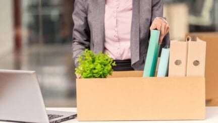 A man packing up his office to relocate for a job.