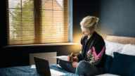 An image of a woman considering cash out refinance to pay off home debt